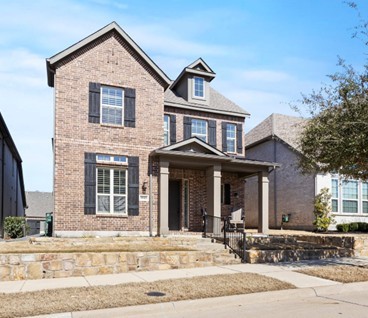 view of front of house featuring brick siding