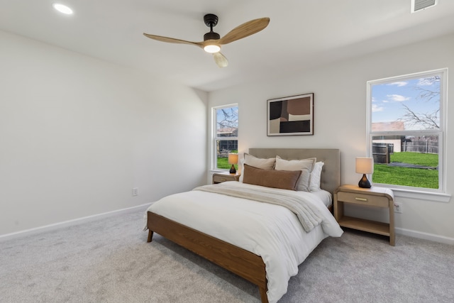 carpeted bedroom featuring recessed lighting, visible vents, baseboards, and ceiling fan