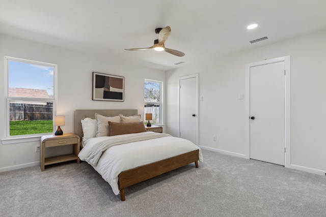 bedroom featuring carpet, visible vents, and baseboards