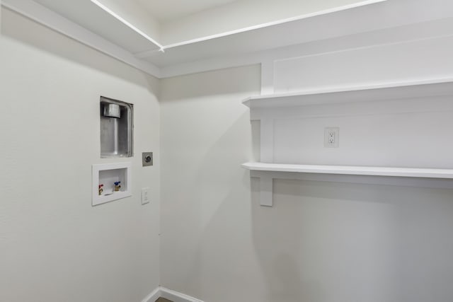 laundry room featuring laundry area, hookup for a washing machine, hookup for an electric dryer, and baseboards