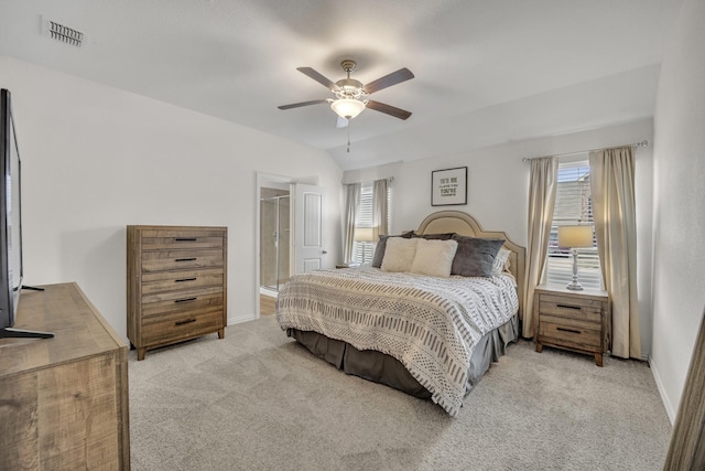 bedroom with visible vents, baseboards, ceiling fan, vaulted ceiling, and light colored carpet