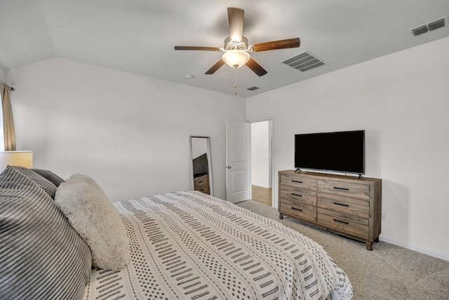 carpeted bedroom featuring visible vents, baseboards, a ceiling fan, and vaulted ceiling