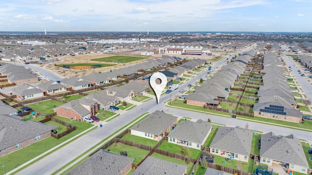 birds eye view of property with a residential view