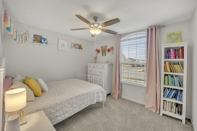 carpeted bedroom with baseboards and ceiling fan