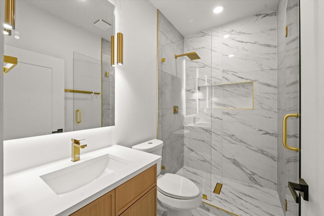 full bath featuring a marble finish shower, toilet, recessed lighting, marble finish floor, and vanity