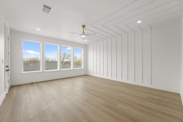 empty room featuring recessed lighting, visible vents, light wood-style floors, and a ceiling fan