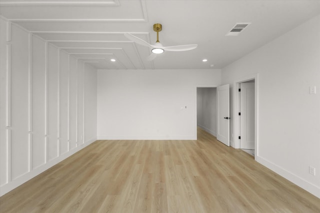 unfurnished room with light wood finished floors, visible vents, baseboards, and ceiling fan