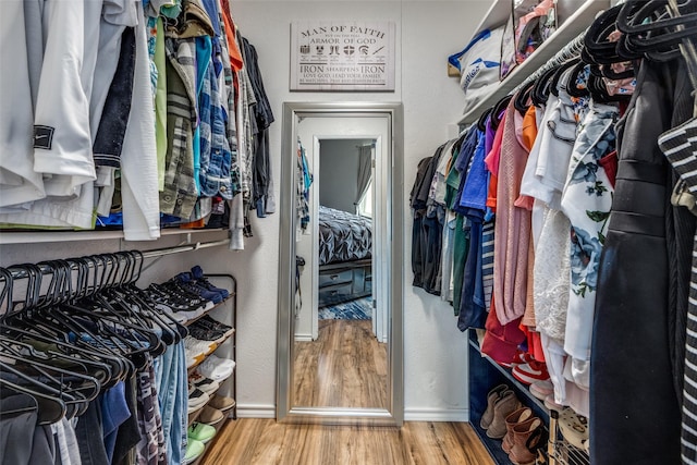 spacious closet with wood finished floors