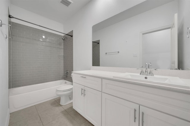 full bathroom featuring tile patterned flooring, visible vents, toilet, bathing tub / shower combination, and vanity