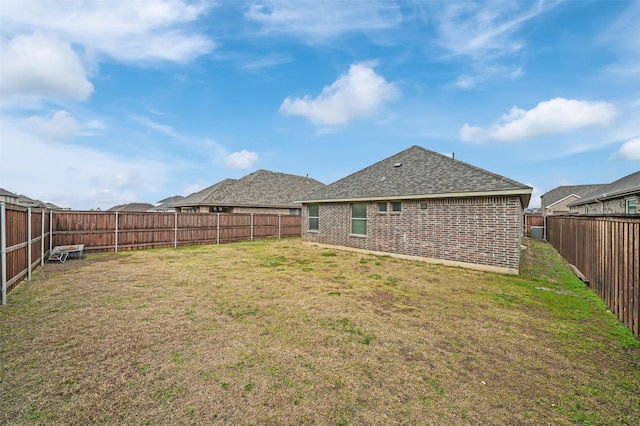 view of yard with a fenced backyard