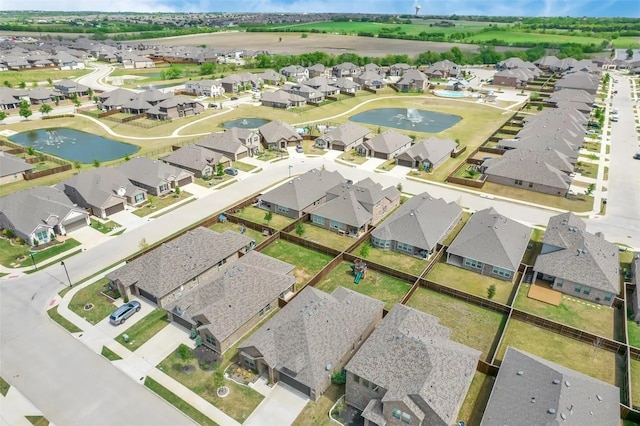 birds eye view of property featuring a residential view and a water view