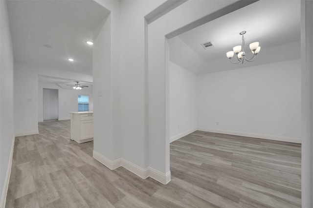 interior space featuring baseboards, visible vents, recessed lighting, ceiling fan with notable chandelier, and light wood-type flooring