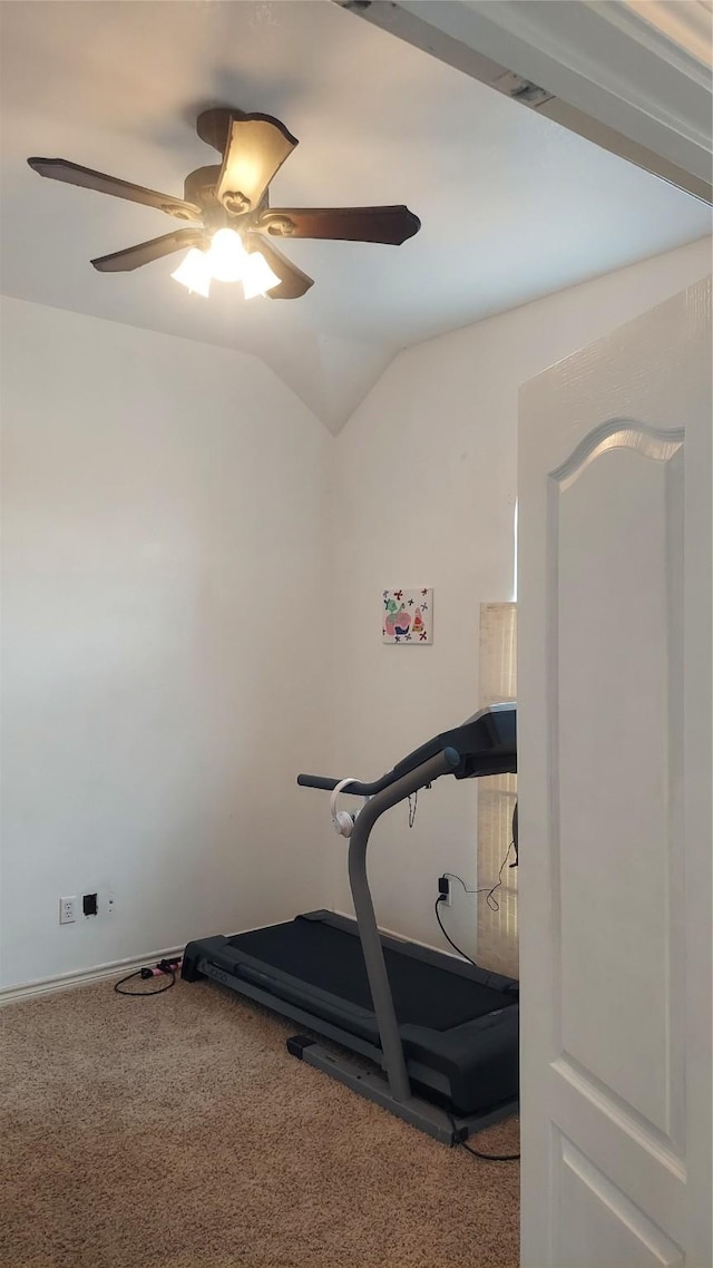 exercise room with ceiling fan, carpet, and vaulted ceiling