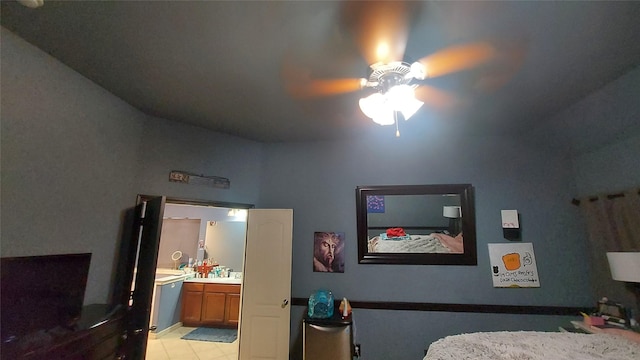 bedroom featuring connected bathroom and ceiling fan