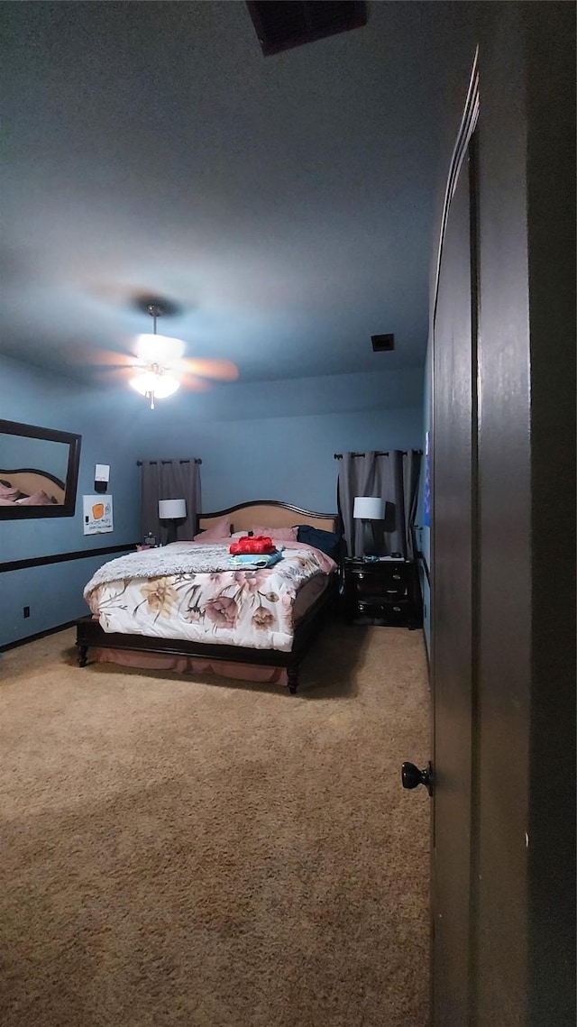 bedroom featuring carpet, visible vents, and ceiling fan