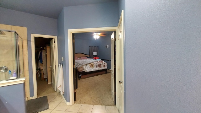 bedroom featuring light tile patterned floors and light colored carpet