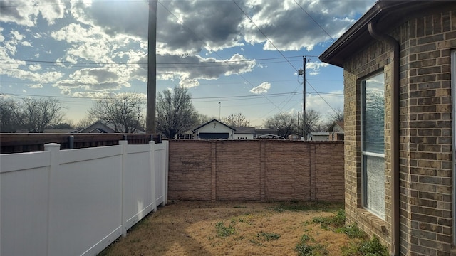 view of yard featuring fence