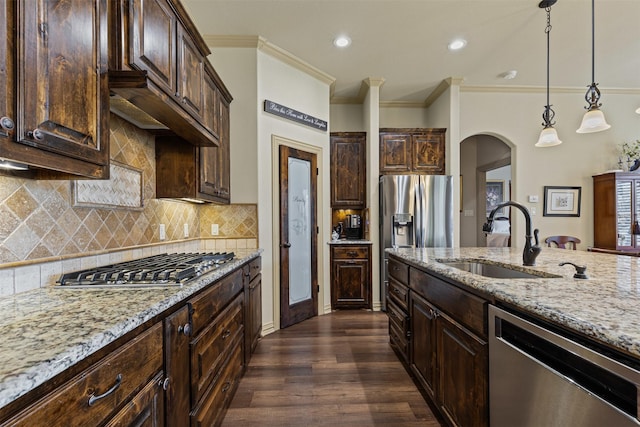 117 Birdie Dr, Lipan, TX 76462 - kitchen featuring appliances with stainless steel finishes, a sink, light stone countertops, crown molding, and dark brown cabinetry