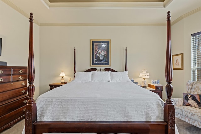 bedroom featuring a tray ceiling and crown molding