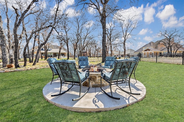 view of yard with a patio area, an outdoor fire pit, and fence