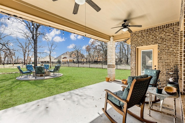 view of patio with a fenced backyard and ceiling fan