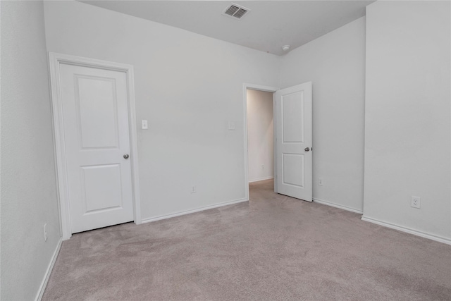 unfurnished bedroom with baseboards, visible vents, and carpet floors