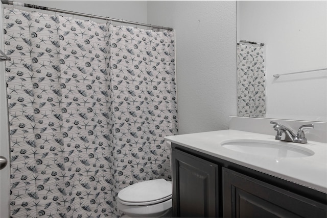 bathroom with vanity, toilet, and a shower with curtain