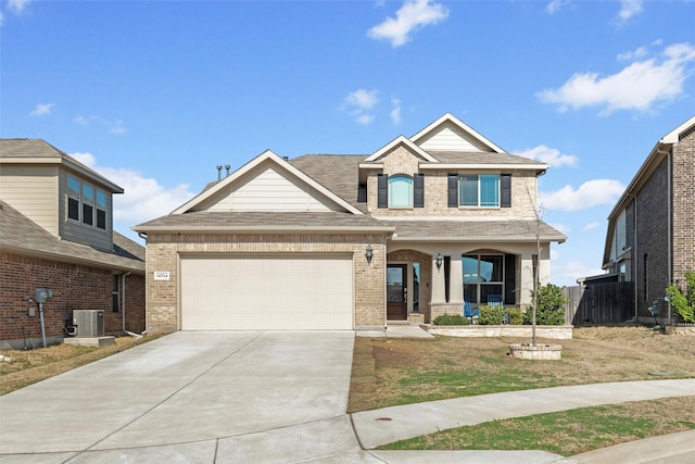 craftsman-style house with brick siding, an attached garage, roof with shingles, central AC unit, and driveway