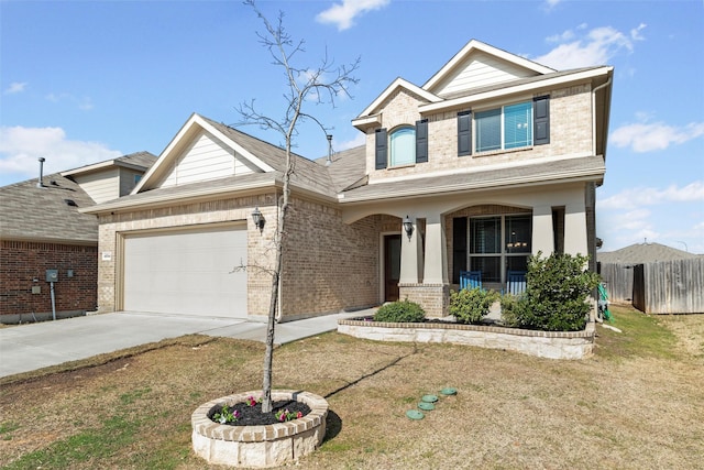 craftsman-style home with driveway, fence, covered porch, a garage, and brick siding