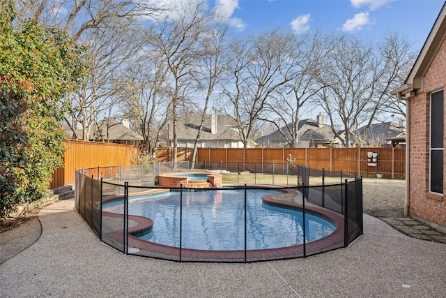 view of pool with an in ground hot tub, a fenced backyard, a fenced in pool, and a patio