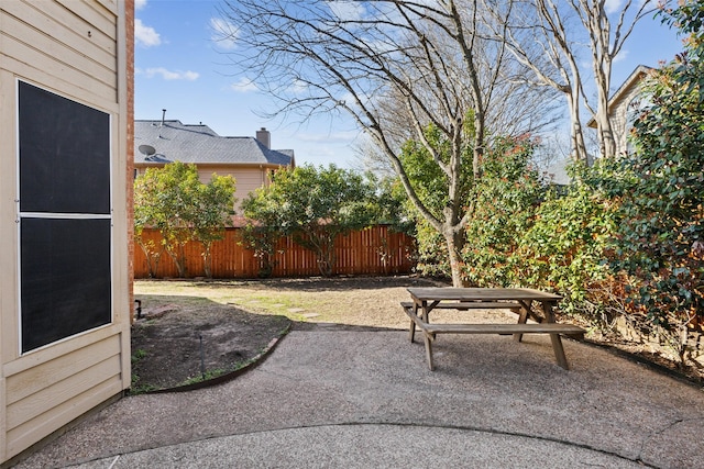 view of patio featuring fence