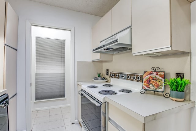 kitchen with electric range, under cabinet range hood, a textured ceiling, light tile patterned flooring, and light countertops