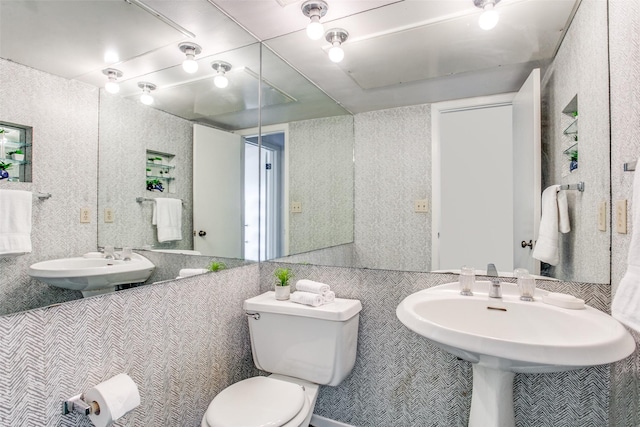 bathroom featuring a sink and toilet