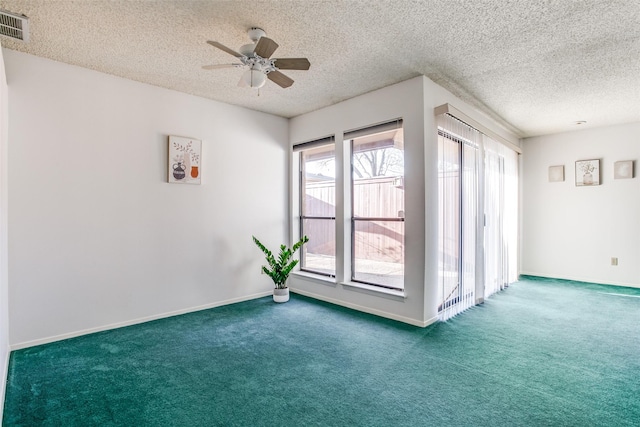 spare room featuring visible vents, baseboards, carpet, and ceiling fan