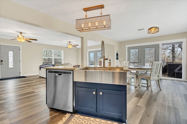 kitchen with dark wood-style floors, visible vents, ceiling fan, dishwasher, and open floor plan