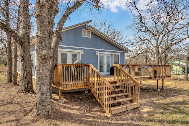 rear view of house featuring french doors and a deck