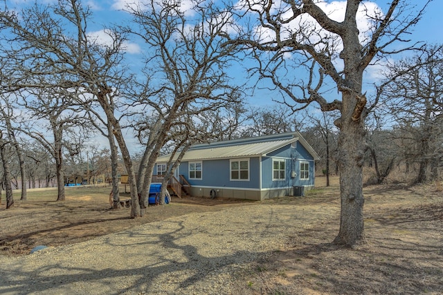 exterior space featuring metal roof