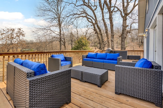 wooden terrace with outdoor lounge area