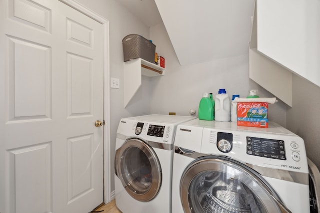 laundry area with laundry area and washer and clothes dryer