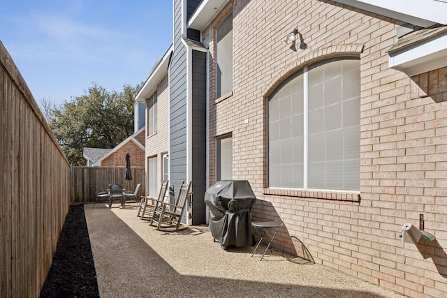 view of patio / terrace with a fenced backyard and grilling area