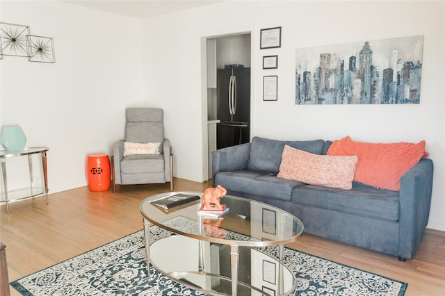 living room featuring wood finished floors and baseboards