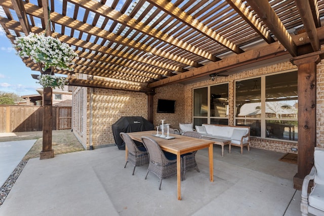 view of patio / terrace featuring area for grilling, outdoor dining space, a pergola, and fence