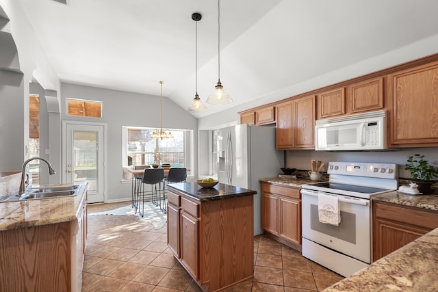 kitchen featuring tile patterned flooring, lofted ceiling, white appliances, stone countertops, and a sink