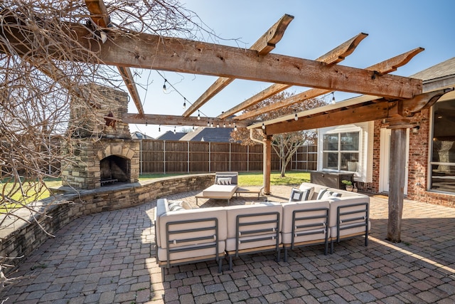 view of patio / terrace featuring an outdoor living space with a fireplace, a pergola, and fence