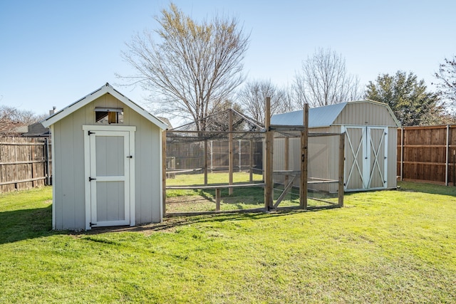 view of shed with a fenced backyard and exterior structure