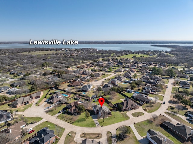 aerial view with a residential view and a water view