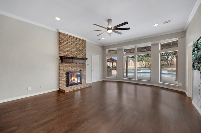 unfurnished living room with visible vents, ornamental molding, wood finished floors, baseboards, and ceiling fan