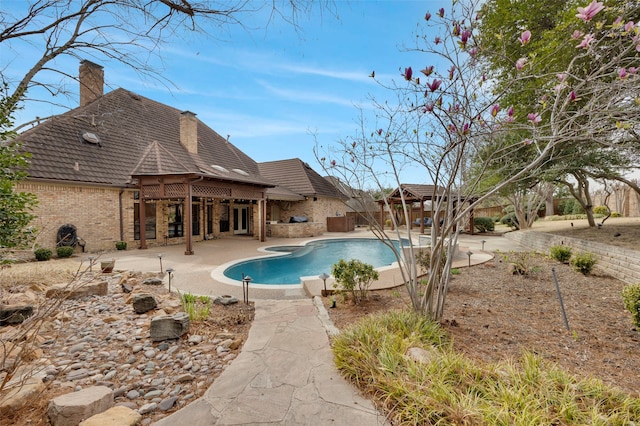 view of swimming pool featuring a gazebo, fence, a patio area, and a fenced in pool