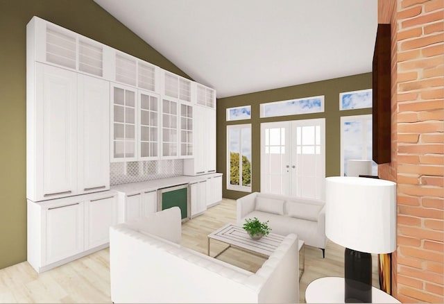 living room with vaulted ceiling, french doors, and light wood-type flooring