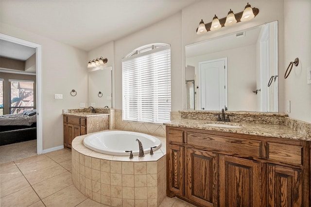 full bathroom with visible vents, a sink, tile patterned flooring, ensuite bathroom, and a bath